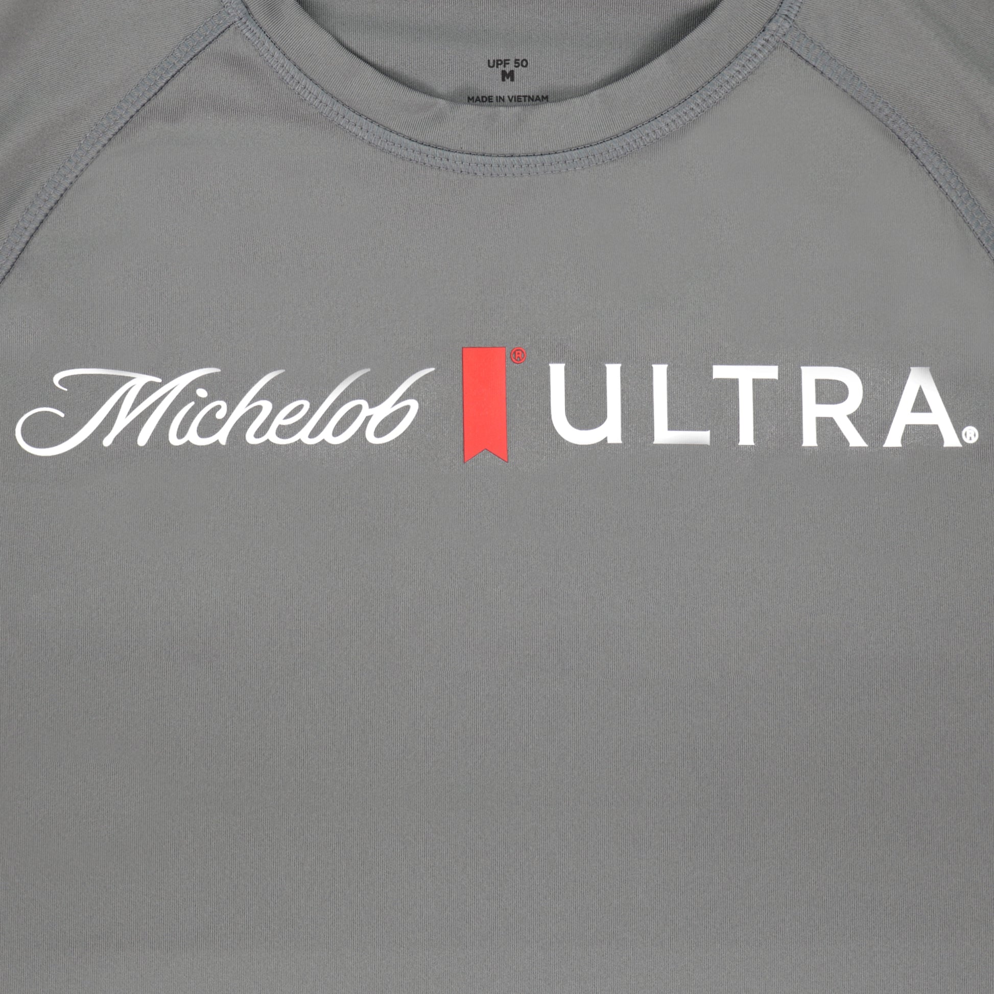 Close up of logo on Michelob ULTRA dri-fit longsleeve