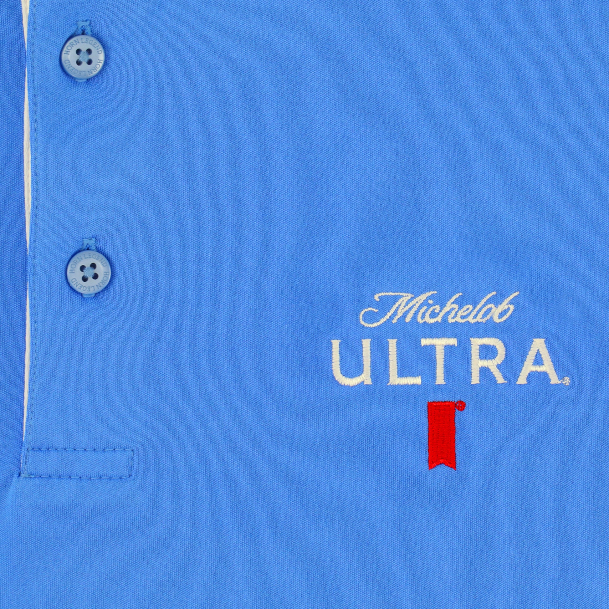 Close up of front embroidery on the Michelob ULTRA Ribbon polo