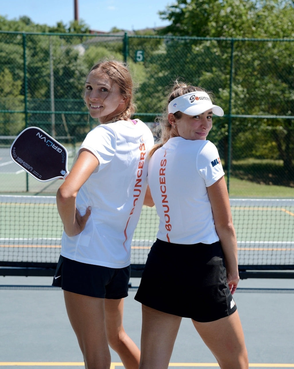 Two players posing in Michelob ULTRA Atlanta Bouncers women's jerseys